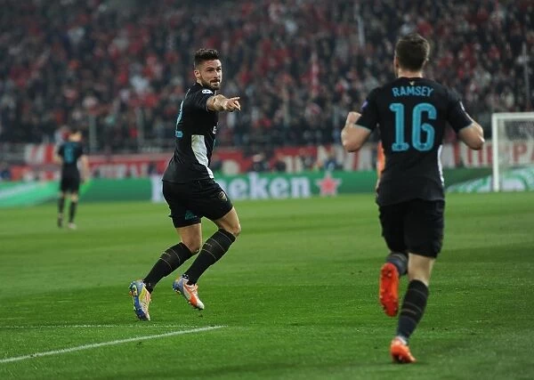 Arsenal's Giroud and Ramsey Celebrate Goal in UEFA Champions League against Olympiacos