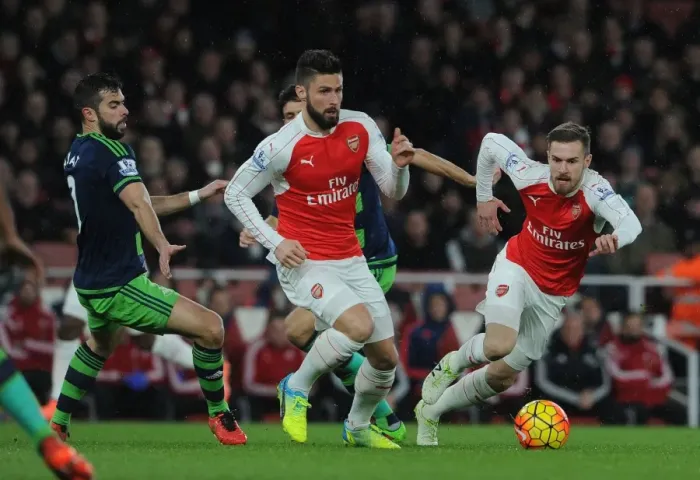 Framed Print : Arsenal's Giroud and Ramsey Outmaneuver Swansea's Amat during Intense Premier League Showdown Framed Print : Arsenal's Giroud and Ramsey Outmaneuver Swansea's Amat during Intense Premier League Showdown