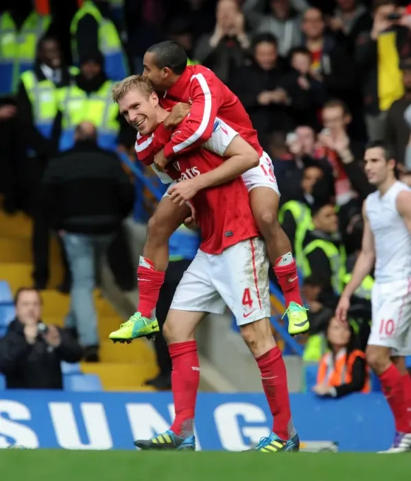 Framed Print : Arsenal's Glorious Comeback: Per Mertesacker and Theo Walcott Celebrate a 5-3 Victory Over Chelsea