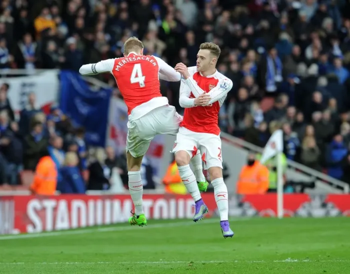 Framed Print : Arsenal's Glory: Mertesacker and Chambers Celebrate Premier League Victory over Leicester City