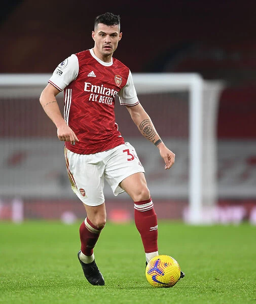 Arsenal's Granit Xhaka in Action at Emptied-Out Emirates Against Crystal Palace (Premier League 2020-21)