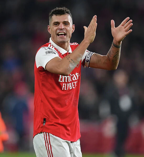 Arsenal's Granit Xhaka Celebrates with Fans after Arsenal v Manchester United in 2022-23 Premier League