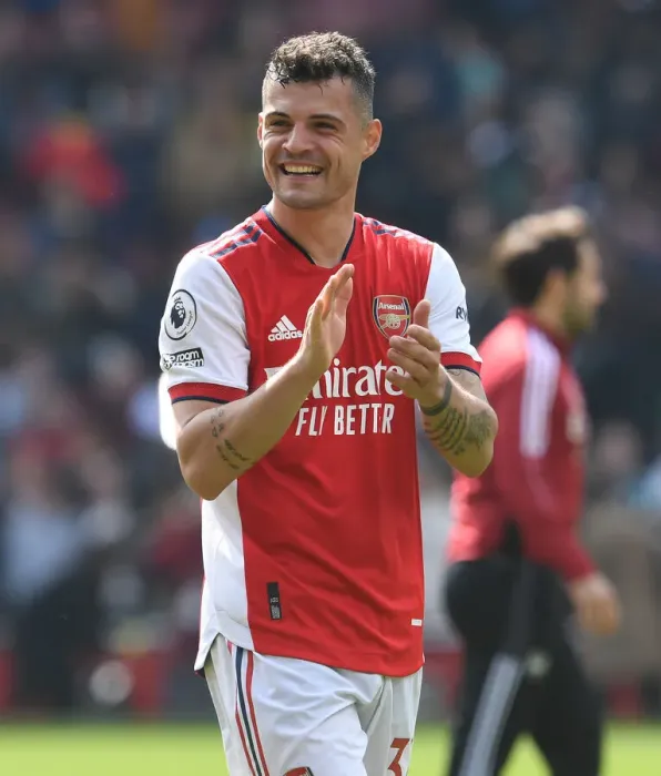Framed Print : Arsenal's Granit Xhaka Celebrates with Fans After Arsenal vs Manchester United Win, 2021-22 Premier League Framed Print : Arsenal's Granit Xhaka Celebrates with Fans After Arsenal vs Manchester United Win, 2021-22 Premier League