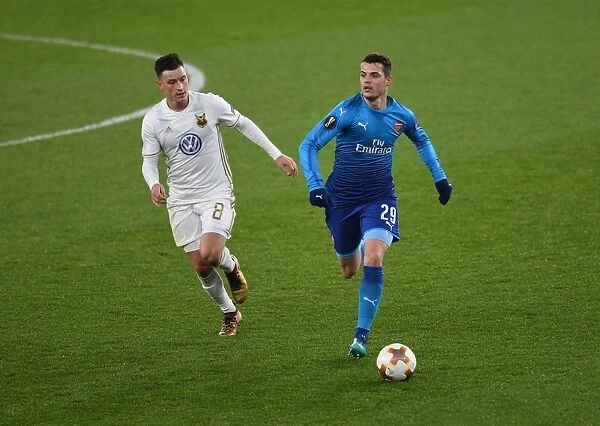 Arsenal's Granit Xhaka Clashes with Östersunds Jamie Hopcutt in Europa League Showdown