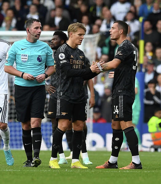 Arsenal's Granit Xhaka Receives Captain's Armband from Martin Odegaard against Leeds United (2022-23)