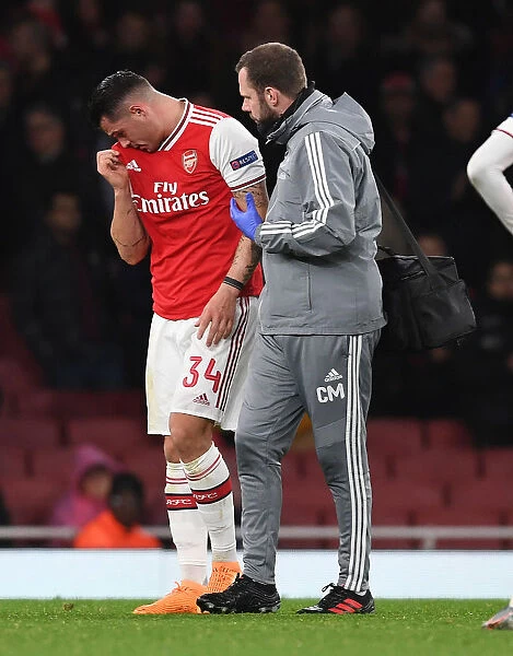 Arsenal's Granit Xhaka Receives Treatment from Physio during Arsenal v Eintracht Frankfurt UEFA Europa League Clash