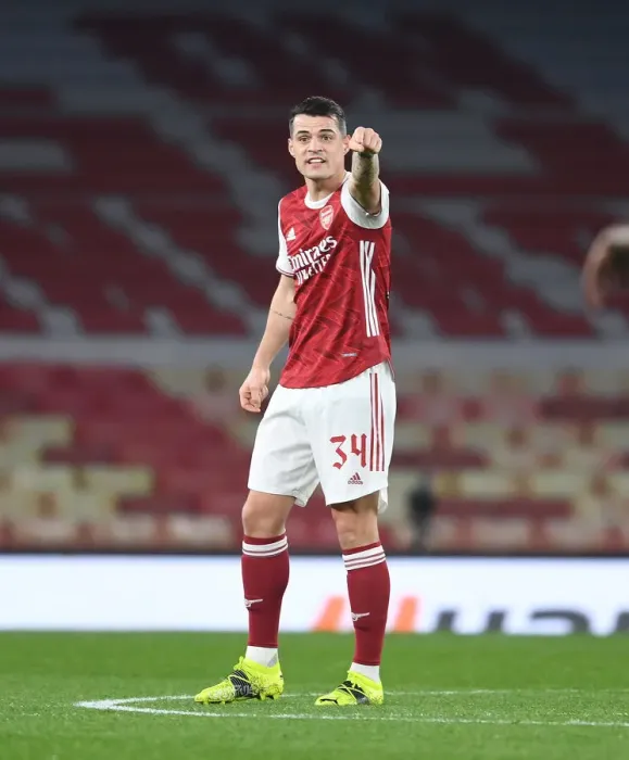 Framed Print : Arsenal's Granit Xhaka in UEFA Europa League: A Lone Warrior at Emirates Stadium Amidst Empty Seats (Arsenal vs. Olympiacos, 2021) Framed Print : Arsenal's Granit Xhaka in UEFA Europa League: A Lone Warrior at Emirates Stadium Amidst Empty Seats (Arsenal vs. Olympiacos, 2021)