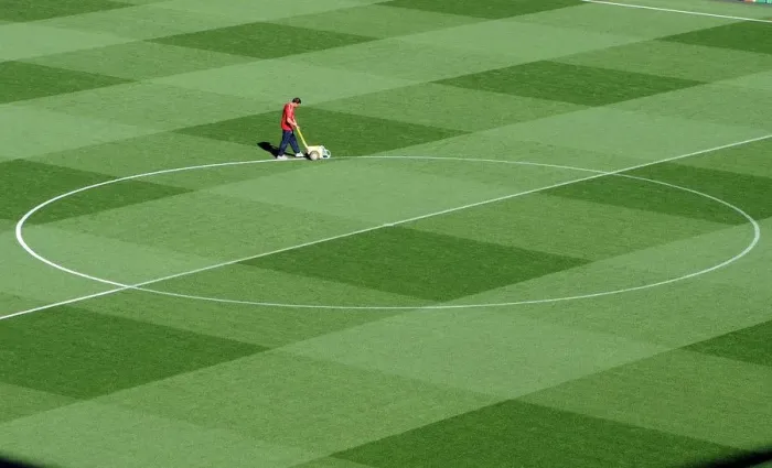 Framed Print : Arsenal's Groundsman Paul Ashcroft Prepares the Emirates Pitch for Arsenal's 2:1 UEFA Champions League Victory over Olympiacos (Group F) Framed Print : Arsenal's Groundsman Paul Ashcroft Prepares the Emirates Pitch for Arsenal's 2:1 UEFA Champions League Victory over Olympiacos (Group F)