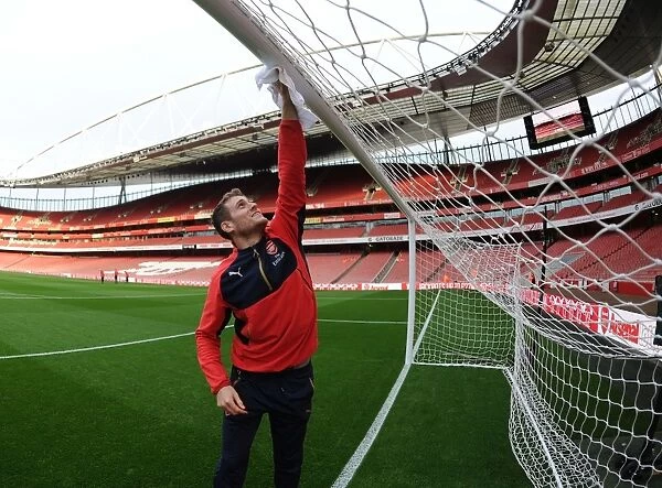 Arsenal's Groundsman Prepares the Emirates Pitch for Arsenal vs Bournemouth (2015-16)