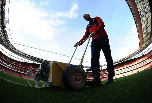 Arsenal's Groundsman Prepares the Emirates Stadium Pitch for Arsenal vs Bournemouth (2015-16)