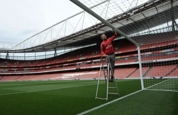 Framed Print : Arsenal's Groundsman Prepares Emirates Stadium for Arsenal v Sunderland Match Framed Print : Arsenal's Groundsman Prepares Emirates Stadium for Arsenal v Sunderland Match