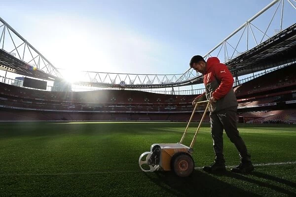 Arsenal's Groundsman Prepares the Pitch for Arsenal v West Bromwich Albion (2016-17)