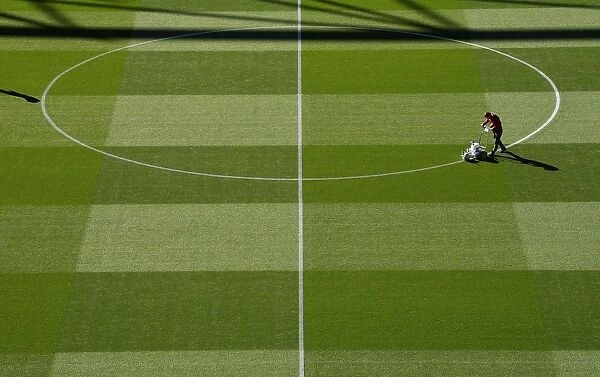 Arsenal's Groundsman Prepares Pitch for Carabao Cup Clash Against Brentford