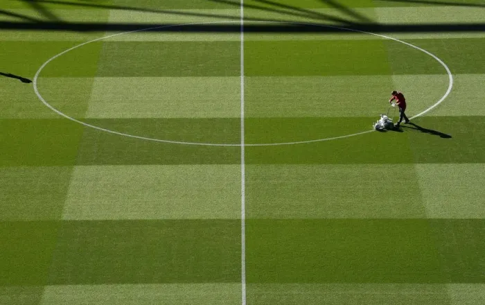 Framed Print : Arsenal's Groundsman Prepares Pitch for Carabao Cup Clash Against Brentford Framed Print : Arsenal's Groundsman Prepares Pitch for Carabao Cup Clash Against Brentford