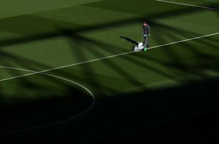 Framed Print : Arsenal's Groundsman Readies the Pitch for Arsenal v Leicester City (2018-19) Framed Print : Arsenal's Groundsman Readies the Pitch for Arsenal v Leicester City (2018-19)