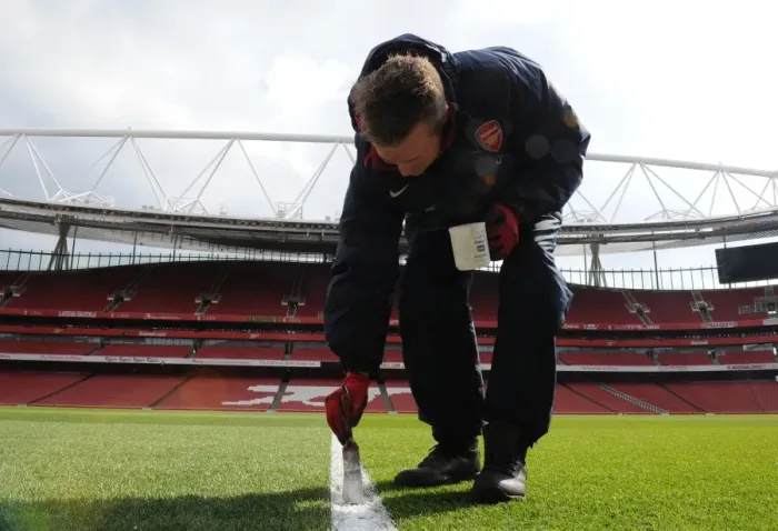 Framed Print : Arsenal's Groundsmen Prepare Emirates Stadium for Arsenal v Reading (2013)