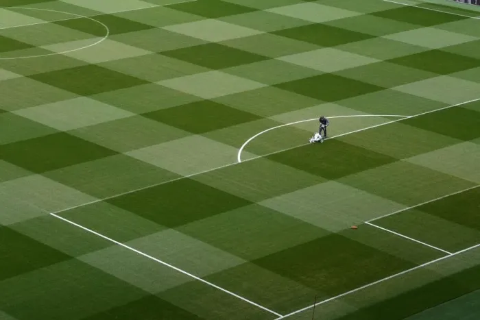 Framed Print : Arsenal's Groundsmen Prepare for Europa League Semi-Final Showdown vs Valencia Framed Print : Arsenal's Groundsmen Prepare for Europa League Semi-Final Showdown vs Valencia