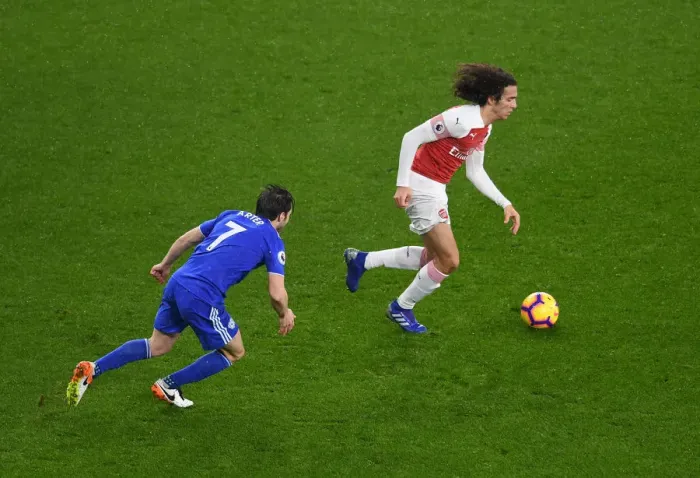 Framed Print : Arsenal's Guendouzi Clashes with Cardiff's Arter in Premier League Showdown