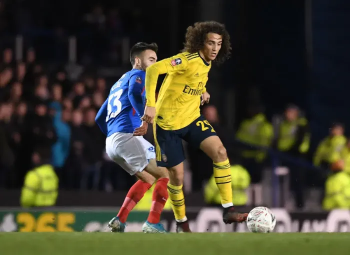 Framed Print : Arsenal's Guendouzi Clashes with Portsmouth's Close in FA Cup Fifth Round Framed Print : Arsenal's Guendouzi Clashes with Portsmouth's Close in FA Cup Fifth Round