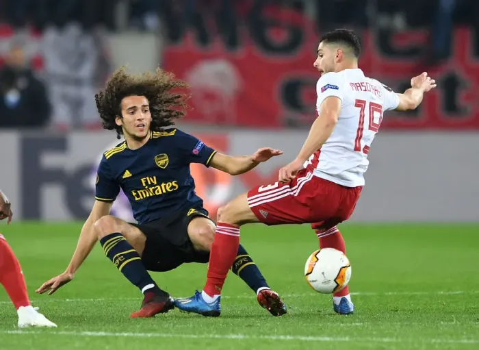 Framed Print : Arsenal's Guendouzi Faces Off Against Olympiacos Masouras in Europa League Clash Framed Print : Arsenal's Guendouzi Faces Off Against Olympiacos Masouras in Europa League Clash