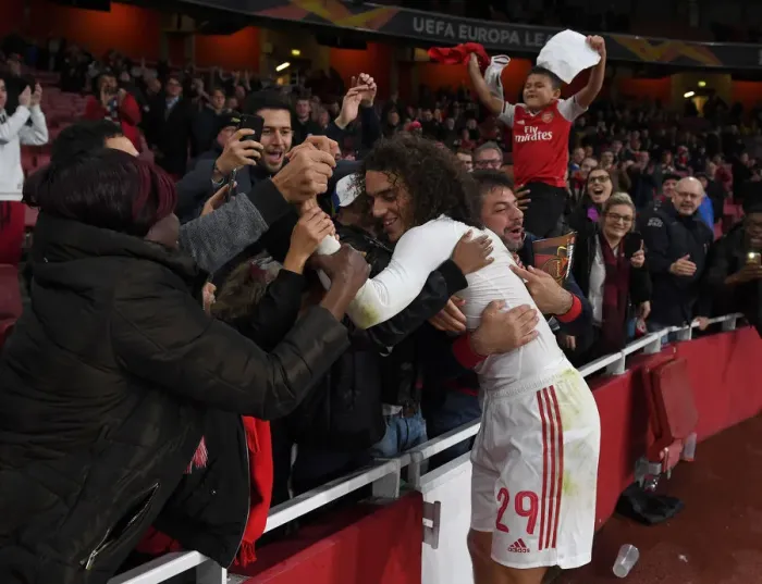 Framed Print : Arsenal's Guendouzi Gifts Shirt to Ecstatic Fan After Europa League Victory