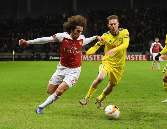 Framed Print : Arsenal's Guendouzi Overpowers Hleb: Matteo Guendouzi's Dominant Performance Against BATE's Aleksandr Hleb in Europa League Clash Framed Print : Arsenal's Guendouzi Overpowers Hleb: Matteo Guendouzi's Dominant Performance Against BATE's Aleksandr Hleb in Europa League Clash