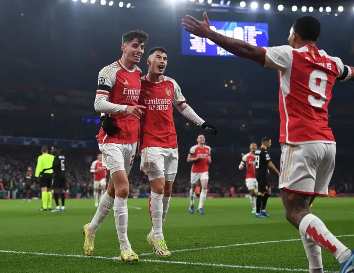 Framed Print : Arsenal's Havertz and Martinelli Celebrate First Goal in 2023-24 Champions League Victory over RC Lens