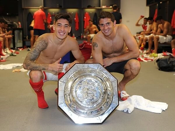 Arsenal's Hector Bellerin and Emiliano Martinez Celebrate Community Shield Victory over Chelsea