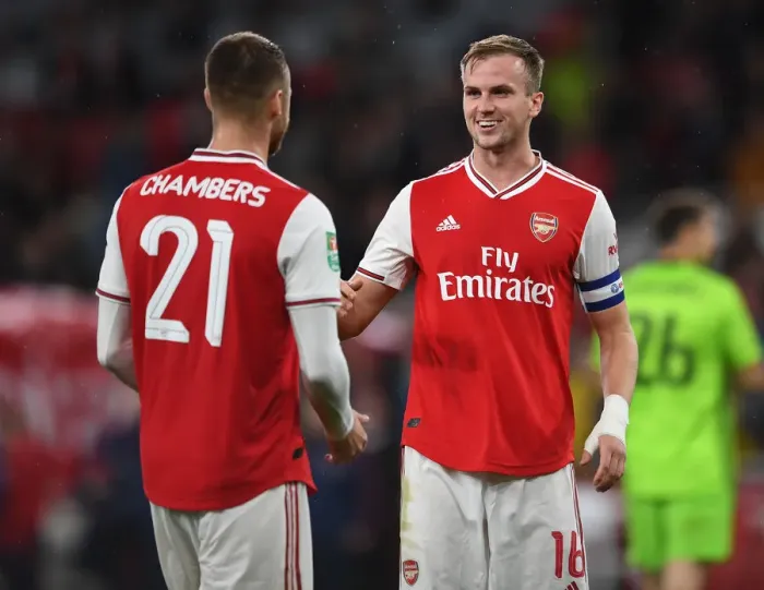 Framed Print : Arsenal's Holding and Chambers Celebrate Carabao Cup Victory over Nottingham Forest