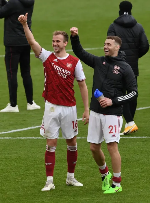 Framed Print : Arsenal's Holding and Chambers: Celebrating Victory Against Brighton in the 2020-21 Premier League