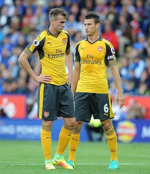 Arsenal's Holding and Koscielny in Action: Premier League 2016-17 - Leicester City vs Arsenal