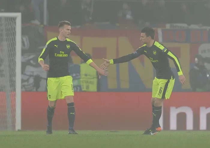 Framed Print : Arsenal's Holding and Koscielny Face Off Against FC Basel in 2016-17 Champions League