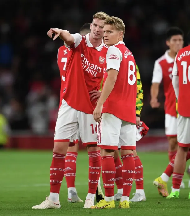 Framed Print : Arsenal's Holding and Odegaard Celebrate Victory Over Aston Villa in 2022-23 Premier League