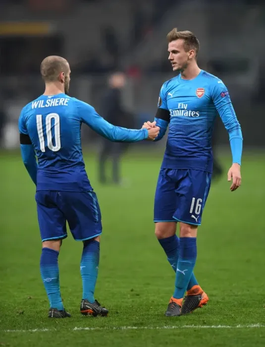 Framed Print : Arsenal's Holding and Wilshere Share a Moment after AC Milan Clash in Europa League Framed Print : Arsenal's Holding and Wilshere Share a Moment after AC Milan Clash in Europa League