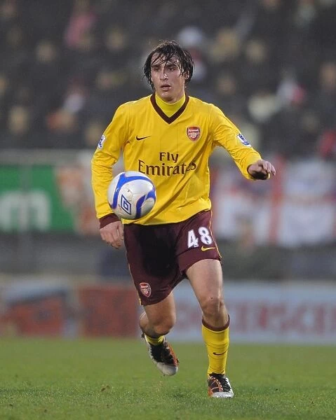 Arsenal's Ignasi Miquel Stands Firm in FA Cup Battle: Arsenal vs. Leyton Orient (2011)
