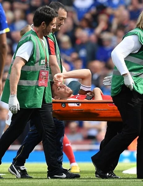 Arsenal's Injured Gabriel Carried Off the Pitch During Arsenal v Everton Match