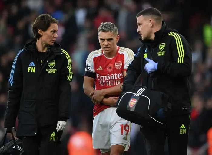 Framed Print : Arsenal's Injured Trossard Tended to by Medical Team During Arsenal v Burnley Match, 2023-24