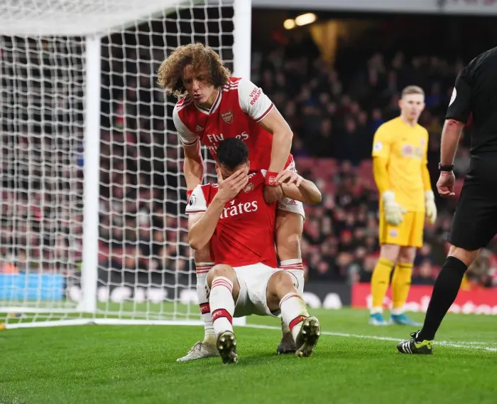 Framed Print : Arsenal's Injury Woes: David Luiz Consoles Hurt Martinelli vs Sheffield United (2019-20) Framed Print : Arsenal's Injury Woes: David Luiz Consoles Hurt Martinelli vs Sheffield United (2019-20)