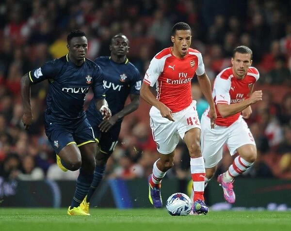 Arsenal's Isaac Hayden Outmaneuvers Victor Wanyama in Capital One Cup Clash