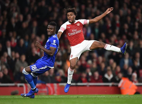 Arsenal's Iwobi Faces Off Against Leicester's Amartey in Premier League Showdown