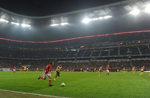 Arsenal's Iwobi Harasses Lahm in Champions League Showdown