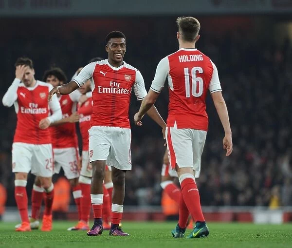 Arsenal's Iwobi and Holding Celebrate Goal in EFL Cup Win over Reading