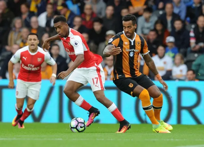 Framed Print : Arsenal's Iwobi and Huddlestone Clash in Intense Premier League Face-off Framed Print : Arsenal's Iwobi and Huddlestone Clash in Intense Premier League Face-off