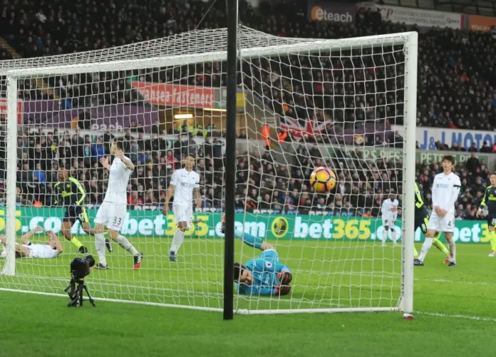 Framed Print : Arsenal's Iwobi Scores Deflected Goal Past Former Team-Mate Fabianski in Swansea Clash