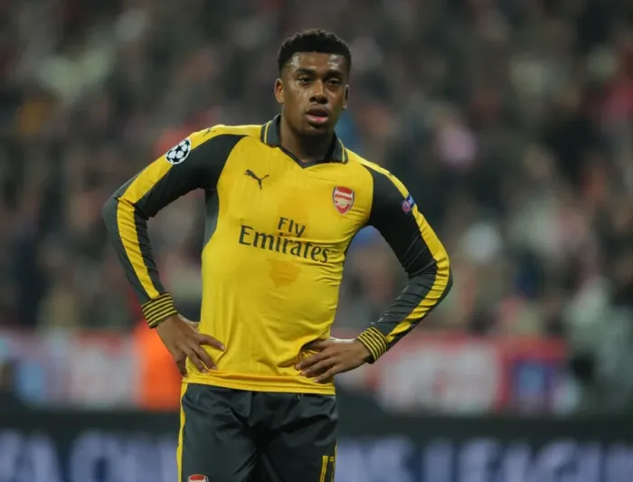 Framed Print : Arsenal's Iwobi Tackles Champions League Glory: Battle at Bayern Munich