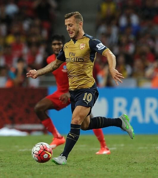 Arsenal's Jack Wilshere in Action against Singapore XI during Barclays Asia Trophy