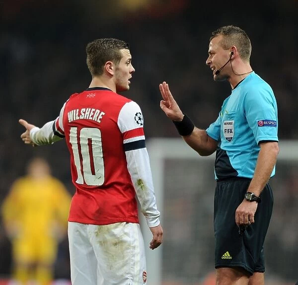 Arsenal's Jack Wilshere Argues with Referee Svein Oddvar Moen during Arsenal v Bayern Munich UEFA Champions League Match