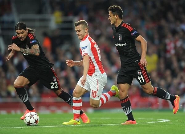 Arsenal's Jack Wilshere Clashes with Besiktas Duo Ersan Gulum and Mustafa Pektemek in Champions League Battle