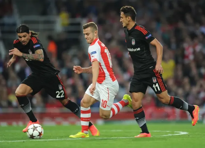 Framed Print : Arsenal's Jack Wilshere Clashes with Besiktas Duo Ersan Gulum and Mustafa Pektemek in Champions League Battle Framed Print : Arsenal's Jack Wilshere Clashes with Besiktas Duo Ersan Gulum and Mustafa Pektemek in Champions League Battle