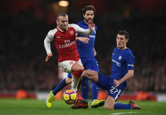 Framed Print : Arsenal's Jack Wilshere Clashes with Chelsea's Andreas Christensen in Premier League Showdown Framed Print : Arsenal's Jack Wilshere Clashes with Chelsea's Andreas Christensen in Premier League Showdown